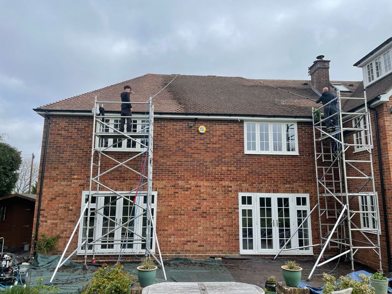 Roof cleaning carried out safely from scaffold towers by The Roof Moss Cleaners in Wellingborough